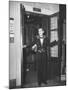 Young Man Blocking the Entrance to the "Lift", in America it Is Called an Elevator-null-Mounted Photographic Print
