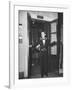 Young Man Blocking the Entrance to the "Lift", in America it Is Called an Elevator-null-Framed Photographic Print