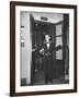 Young Man Blocking the Entrance to the "Lift", in America it Is Called an Elevator-null-Framed Photographic Print