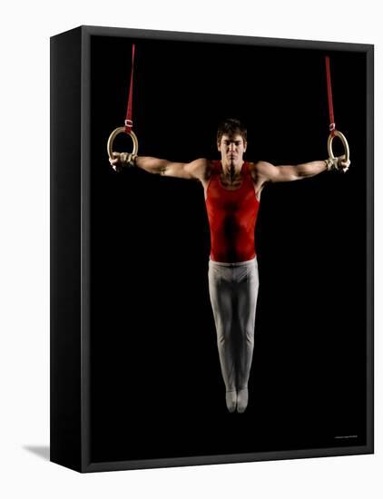 Young Man Exercising on Gymnastic Rings, Bainbridge Island, Washington State, USA-null-Framed Stretched Canvas