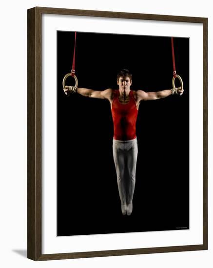 Young Man Exercising on Gymnastic Rings, Bainbridge Island, Washington State, USA-null-Framed Photographic Print