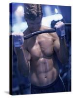 Young Man Exercising with Barbells-null-Stretched Canvas