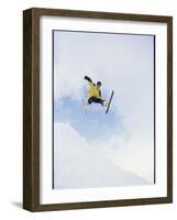 Young Man in Mid Air Wearing Skis-null-Framed Photographic Print