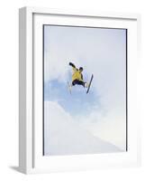 Young Man in Mid Air Wearing Skis-null-Framed Photographic Print