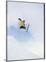 Young Man in Mid Air Wearing Skis-null-Mounted Photographic Print