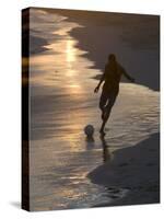 Young Man Playing Football at Sandbeach in Twilight, Santa Maria, Sal, Cape Verde, Africa-Michael Runkel-Stretched Canvas