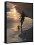 Young Man Playing Football at Sandbeach in Twilight, Santa Maria, Sal, Cape Verde, Africa-Michael Runkel-Framed Stretched Canvas