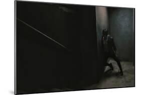 Young Man Posing in Dark Setting-Luis Beltran-Mounted Photographic Print