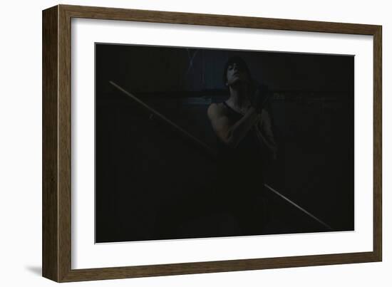 Young Man Posing in Dark Setting-Luis Beltran-Framed Photographic Print