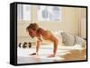 Young Man Preforming Push Up Exercise in Gym, New York, New York, USA-Chris Trotman-Framed Stretched Canvas