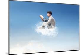 Young Man Reads Sitting On A Cloud-olly2-Mounted Art Print