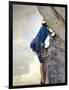 Young man rock climbing up a vertical cliff-null-Framed Photographic Print