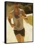 Young Man Running on the Beach-null-Framed Stretched Canvas