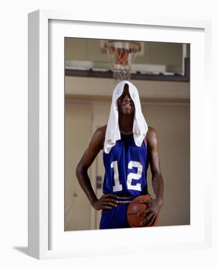 Young Man Standing Holding a Basketball with a Towel on His Head-null-Framed Photographic Print
