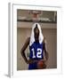 Young Man Standing Holding a Basketball with a Towel on His Head-null-Framed Photographic Print