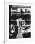 Young Man Standing in Front of a Herbs and Fish Market Displaying Racks of Fish-Howard Sochurek-Framed Photographic Print