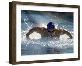 Young Man Swimming the Butterfly Stroke-null-Framed Premium Photographic Print