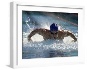 Young Man Swimming the Butterfly Stroke-null-Framed Premium Photographic Print