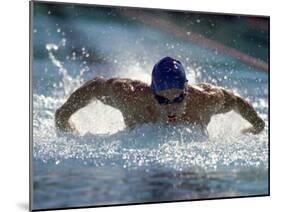 Young Man Swimming the Butterfly Stroke-null-Mounted Premium Photographic Print