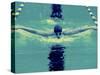 Young Man Swimming the Butterfly Stroke-null-Stretched Canvas