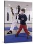 Young Man Teaching a Boy Martial Arts-null-Stretched Canvas