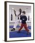 Young Man Teaching a Boy Martial Arts-null-Framed Photographic Print