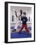 Young Man Teaching a Boy Martial Arts-null-Framed Photographic Print