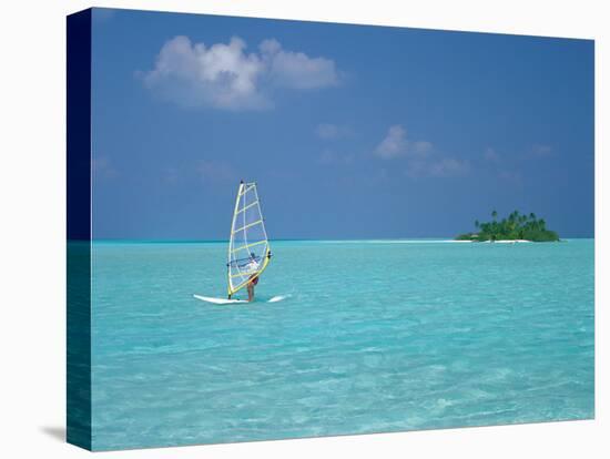 Young Man Windsurfing Near Tropical Island and Lagoon in the Maldives, Indian Ocean-Sakis Papadopoulos-Stretched Canvas