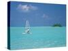 Young Man Windsurfing Near Tropical Island and Lagoon in the Maldives, Indian Ocean-Sakis Papadopoulos-Stretched Canvas