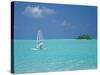 Young Man Windsurfing Near Tropical Island and Lagoon in the Maldives, Indian Ocean-Sakis Papadopoulos-Stretched Canvas