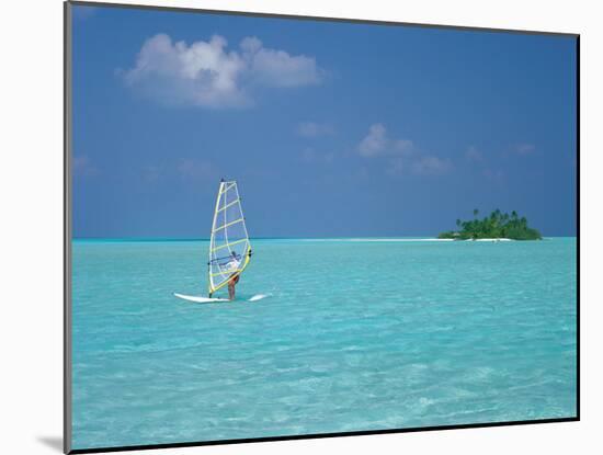 Young Man Windsurfing Near Tropical Island and Lagoon in the Maldives, Indian Ocean-Sakis Papadopoulos-Mounted Photographic Print