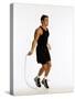 Young Man Working Out with Jump Rope-Chris Trotman-Stretched Canvas