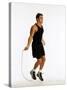 Young Man Working Out with Jump Rope-Chris Trotman-Stretched Canvas