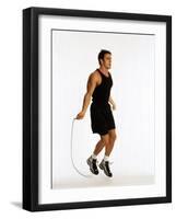 Young Man Working Out with Jump Rope-Chris Trotman-Framed Photographic Print