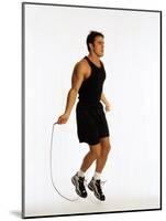 Young Man Working Out with Jump Rope-Chris Trotman-Mounted Photographic Print