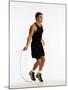 Young Man Working Out with Jump Rope-Chris Trotman-Mounted Photographic Print