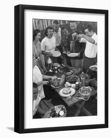 Young Married Couples Enjoying a Backyard Buffet Feast , Featuring Spaghetti-Nina Leen-Framed Premium Photographic Print