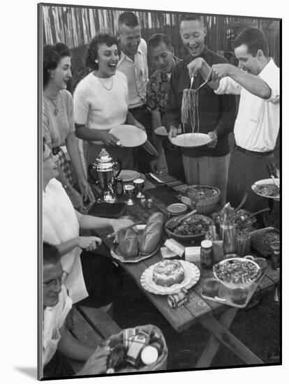 Young Married Couples Enjoying a Backyard Buffet Feast , Featuring Spaghetti-Nina Leen-Mounted Photographic Print