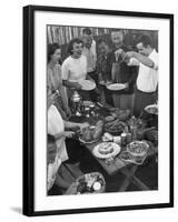 Young Married Couples Enjoying a Backyard Buffet Feast , Featuring Spaghetti-Nina Leen-Framed Photographic Print