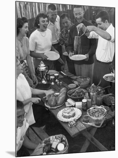 Young Married Couples Enjoying a Backyard Buffet Feast , Featuring Spaghetti-Nina Leen-Mounted Photographic Print