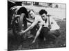 Young Men Change a Tire on an Automobile, Ca. 1918-null-Mounted Photographic Print