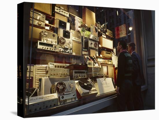 Young Men Men Look at a Window Display of Stereo and Recording Equipment, New York, NY, 1963-Yale Joel-Stretched Canvas