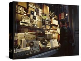 Young Men Men Look at a Window Display of Stereo and Recording Equipment, New York, NY, 1963-Yale Joel-Stretched Canvas