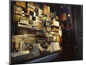 Young Men Men Look at a Window Display of Stereo and Recording Equipment, New York, NY, 1963-Yale Joel-Mounted Photographic Print