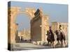 Young Men on Camels, Monumental Arch, Archaelogical Ruins, Palmyra, Syria-Christian Kober-Stretched Canvas