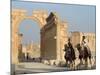 Young Men on Camels, Monumental Arch, Archaelogical Ruins, Palmyra, Syria-Christian Kober-Mounted Photographic Print