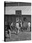 Young Men Playing Basketball with a Homemade Basket in a Farmyard-null-Stretched Canvas