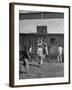 Young Men Playing Basketball with a Homemade Basket in a Farmyard-null-Framed Photographic Print