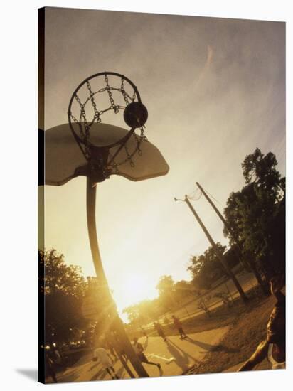 Young Men Playing Basketball-null-Stretched Canvas