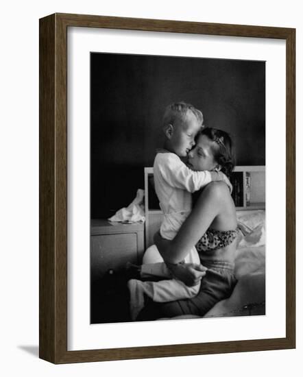 Young Mother Hugging One of Her Sons-Mark Kauffman-Framed Photographic Print